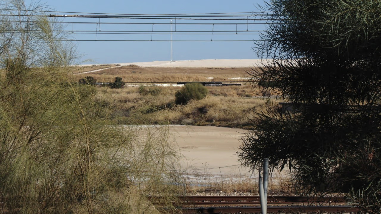 Phosphogypsum area beyond rails.